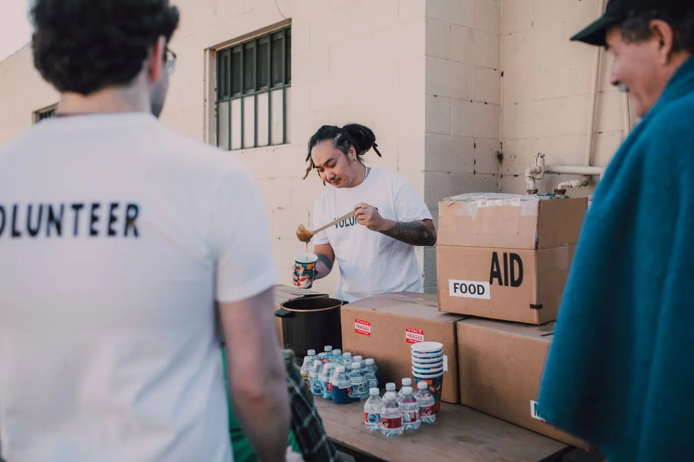 Volunteers preparing food relief for their community