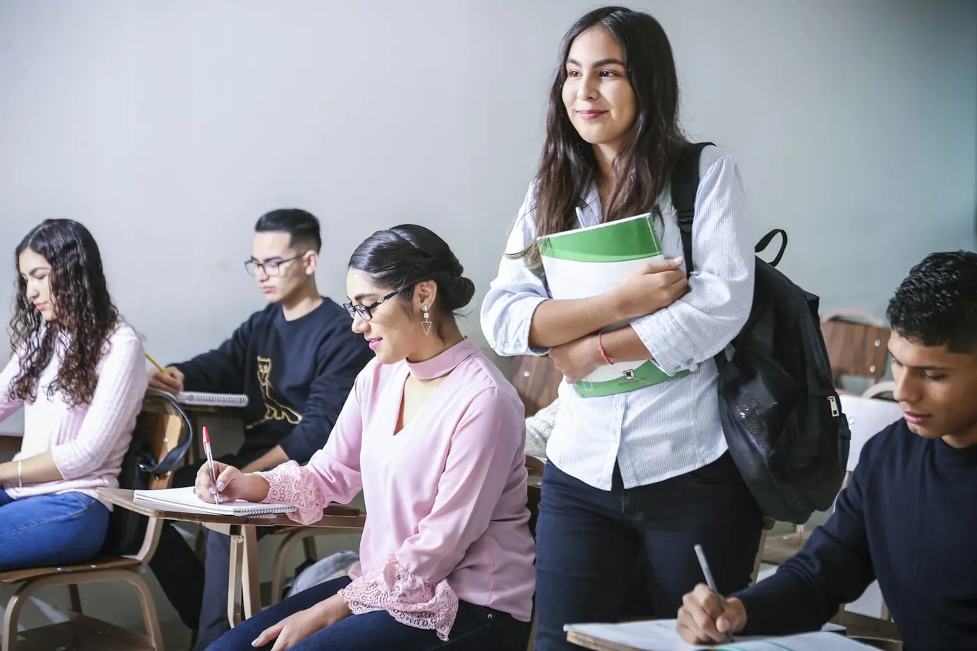 A mentor working with a young student