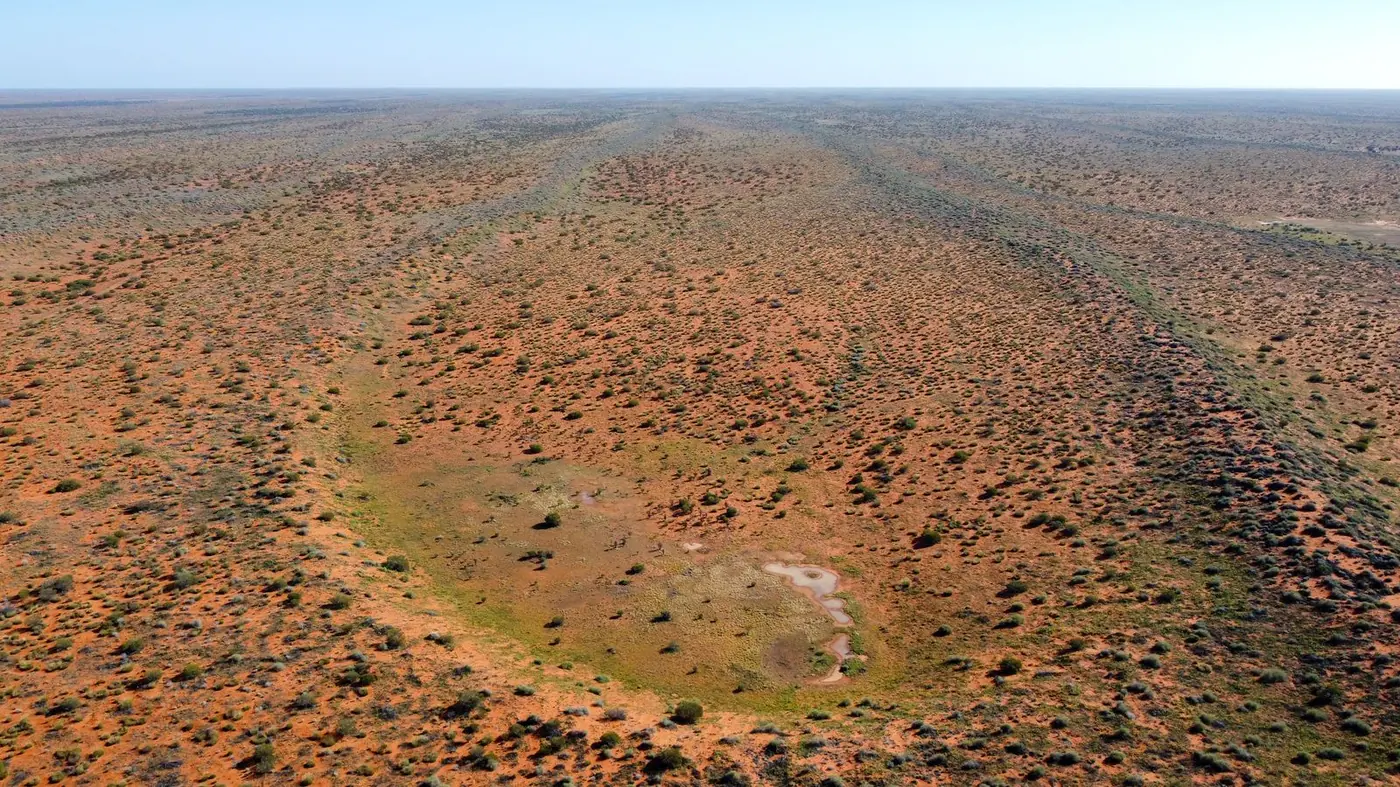 Vast Australian outback landscape under an open sky